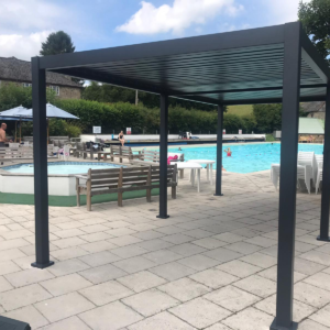 Modern Aluminum Metal Pergola – 26.2' x 9.8' Dark Grey Bioclimatic Structure with Louvred Roof for Hospitality Projects